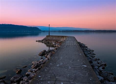 Pier At The Lake Murtensee At Sunset Stock Image Image Of Coast