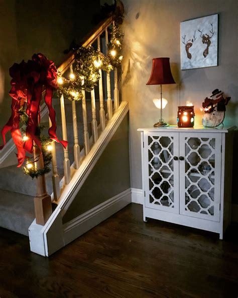 Small Foyer Decorated For Christmas Stair Railing Wrapped In Garland