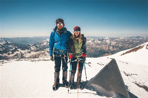Couple Climbers Man And Woman Reached Elbrus Mountain Summit Stock