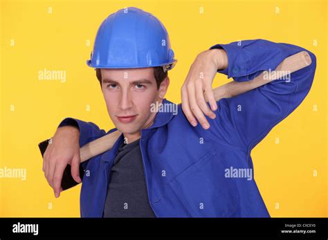 Young Builder Posing With Sledge Hammer Stock Photo Alamy