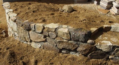 When building a simple stone wall, look. How to build a simple, cheap, garden retaining wall.