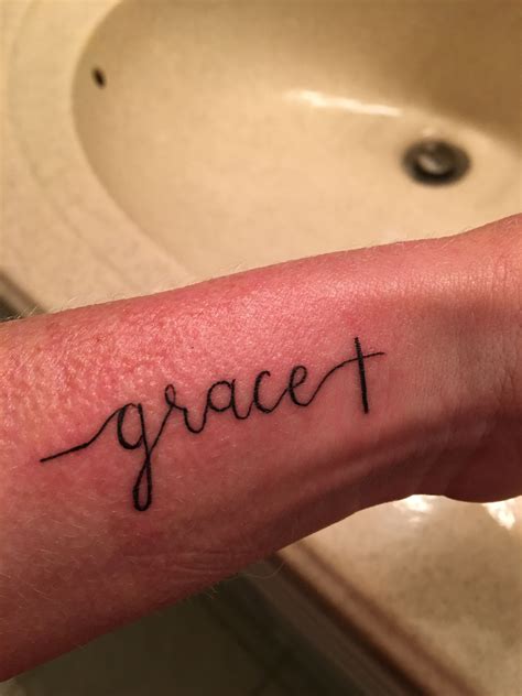 A Persons Arm With The Word Gracet Written On It In Cursive Font