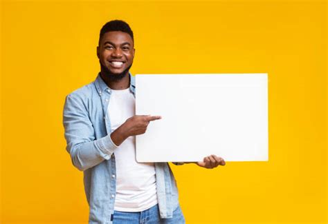 246700 Guy Holding Sign Stock Photos Pictures And Royalty Free Images