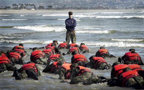 During A Hell Week Surf Drill Evolution A Navy Seal Instructor Assists