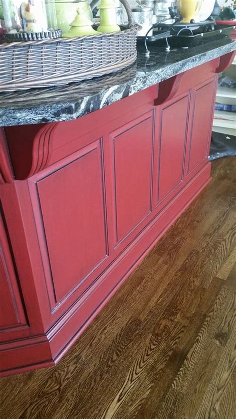 Kandra kole interiors gave this traditional kitchen a retro lift thanks to red appliances and black cabinetry. Sherwin-Williams for Your Home Crabby Apple Red with a ...
