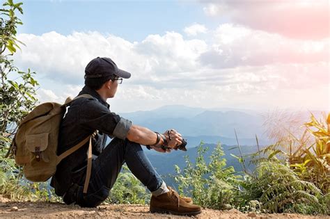 Premium Photo Man Traveler With Photo Camera And Backpack Hiking