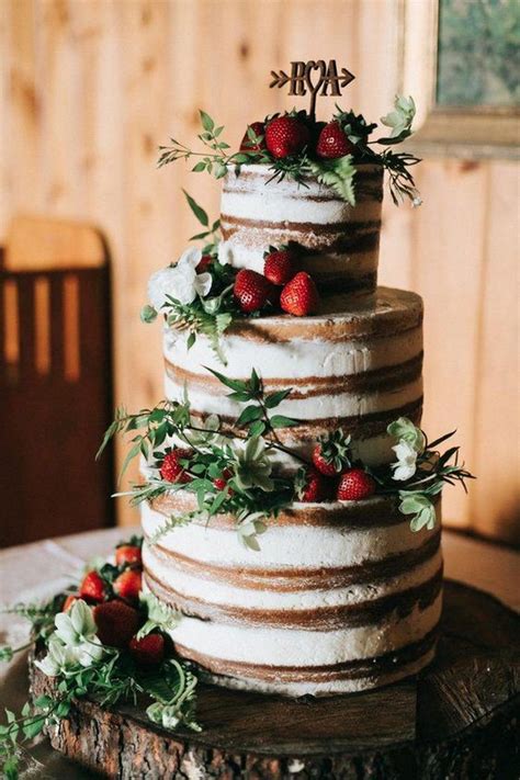 semi naked rustic wedding cake with strawberries emmalovesweddings