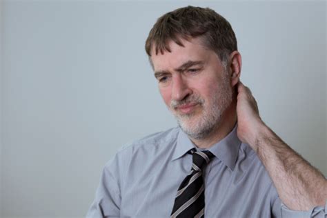 Man With Pain In The Neck Stock Photo Download Image Now Adult