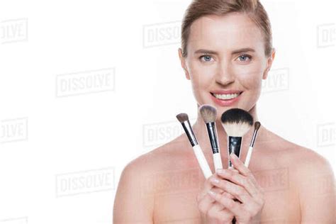 Female With Clean Skin Holding Cosmetic Brushes Isolated On White