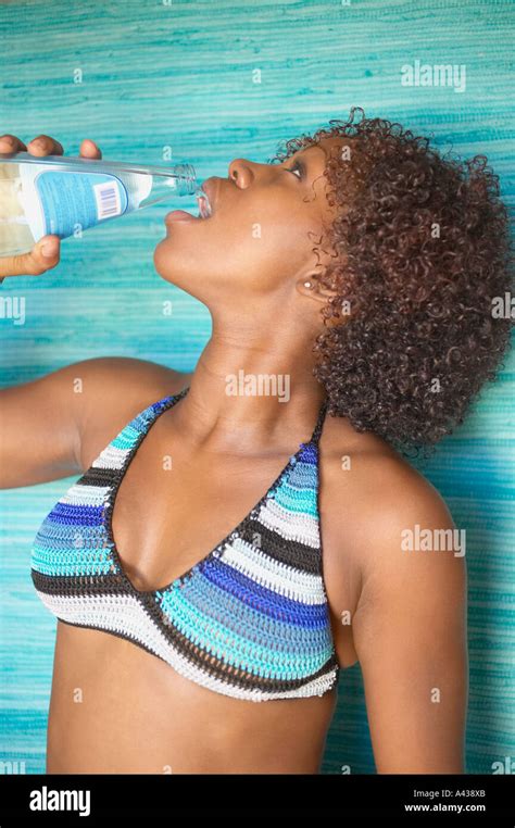 Woman In Bikini Drinking Bottled Water Stock Photo Alamy