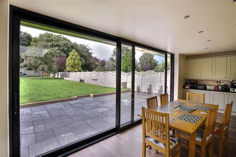 Sliding door systems sliding glass door guest bedrooms master bedroom glass structure folding doors space saving furniture bespoke design minimalism. Aluminium Sliding Door, Colwyn Bay | John Knight Glass