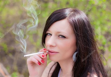Pretty Woman Smoking — Stock Photo © Saharrr 6272063