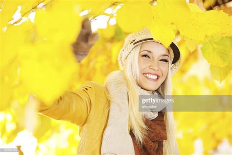 Beautiful Woman Enjoying In A Sunny Autumn Day High Res Stock Photo