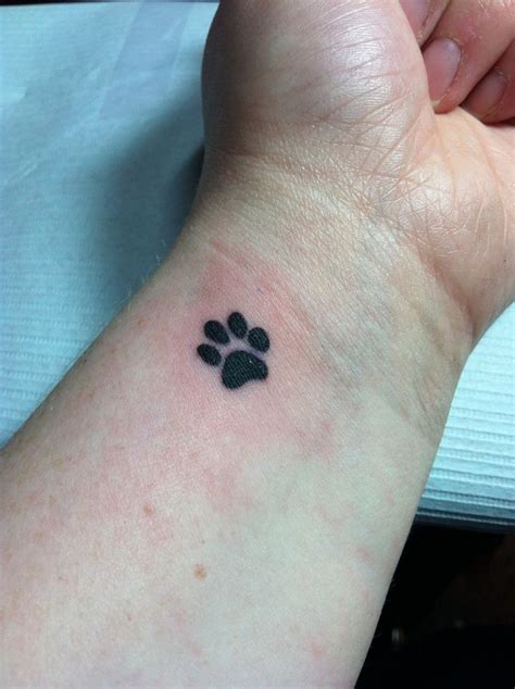 Tiny Paw Print Tattoo On Wrist