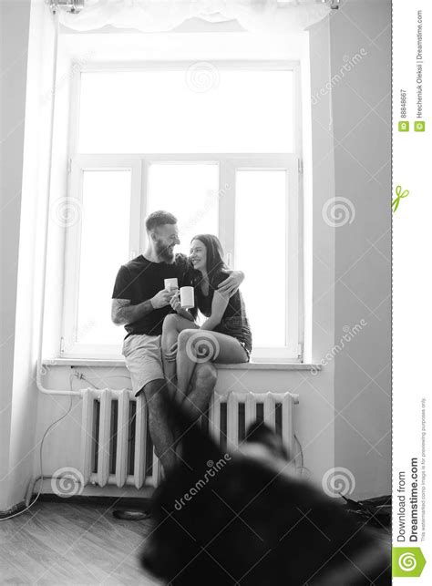 couple on the background of a window stock image image of adult apartment 88848667