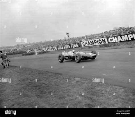 John Surtees Driving A Lola Climax Takes Madgwick Corner Suring The