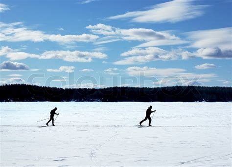 Skiers Nordic Skiing On Frozen Lake Stock Image