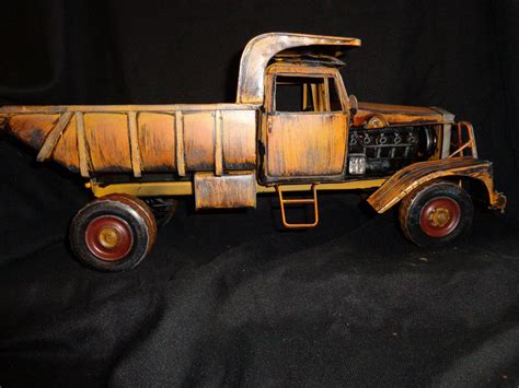 Home › Vintage Toys Yellow Dump Truck Tin Toy