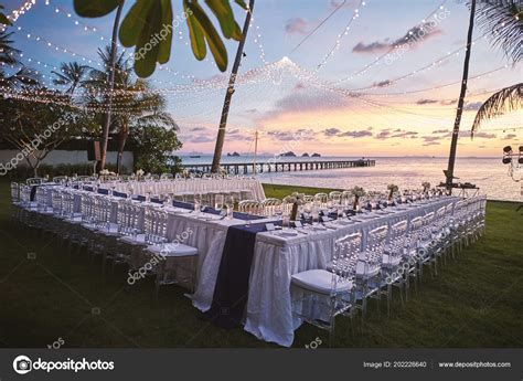Beach Wedding Reception Dinner Venue Arrangement Sunset Orange Sky