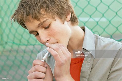 Teen Boy Smoking High Res Stock Photo Getty Images
