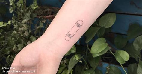 Fine Line Skateboard Tattoo On The Wrist