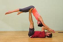 It also lets you attempt poses which you the person doing a backbend will lean back on their partner's back and open the front of their heart and chest. Acroyoga — Wikipédia