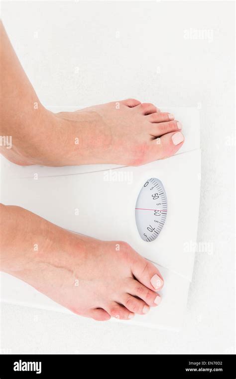 Womans Feet On Scales Stock Photo Alamy