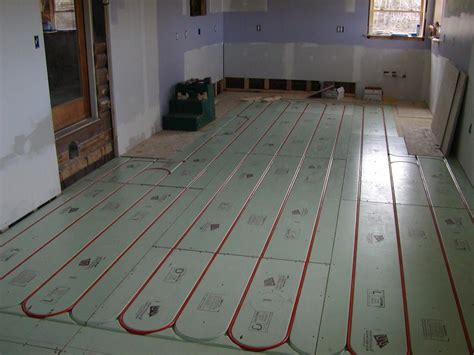 The toh project house has a manifold in the basement where all the tubing originates and returns. Floor heating systems, Radiant floor heating, Hydronic ...