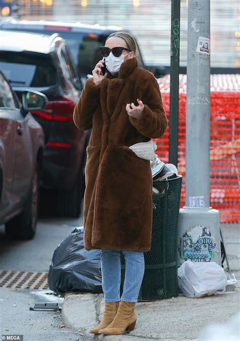 Chloe Sevigny Looks Animated As She Chats On The Phone During A Brisk