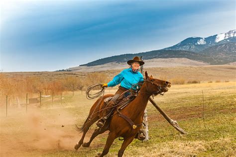 Western Cowgirl Riding Horse In Colorado Michael Deyoung