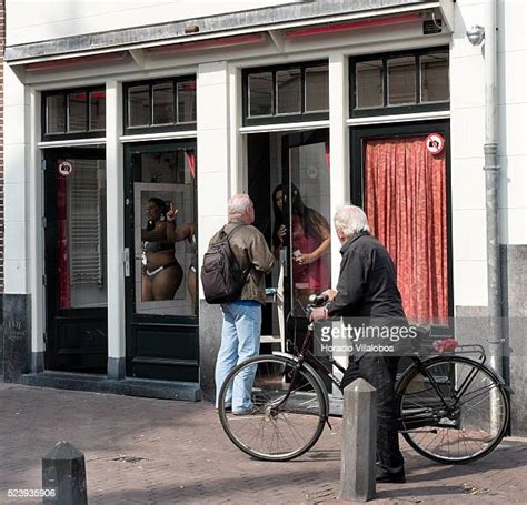 Amsterdam Red Light District Photos And Premium High Res Pictures