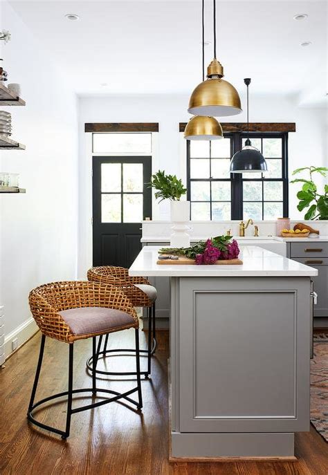 Small kitchens with white cabinets can help your space look bigger, and brighter, which can enhance the entire atmosphere of your room. White Kitchen with Grey Island - Transitional - Bathroom