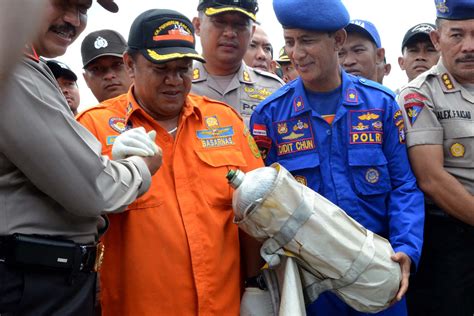 Airasia Flight Qz8510 Photos Recovered Bodies Are Identified And Returned To Families For