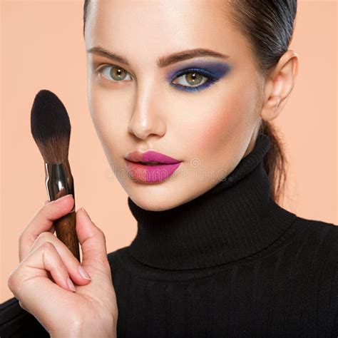 Portrait Of A Girl With Cosmetic Brush Near Face Woman Making Makeup