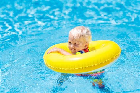 Child In Swimming Pool On Toy Ring Kids Swim Stock Image Image Of