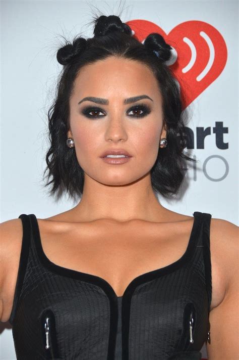 in an edgy minidress and supertrendy hair topped off with a seriously dramatic smokey eye demi