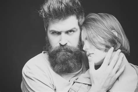 fashion shot of couple after haircut hairstyle concept woman on mysterious face with bearded