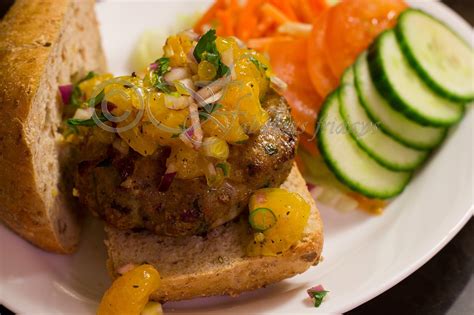 Perfect beef alternative to throw on the grill for a moist, flavorful gross. fabulous fridays: Jerk chicken burger with Orange salsa