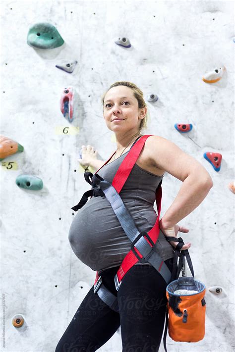 Pregnant Woman Rock Climbing Indoors By Stocksy Contributor Jovana Milanko Stocksy