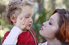 son comforting crying mother stock