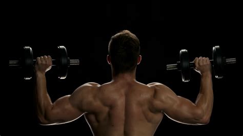 Muscular Man Lifting Dumbbells Young Man Stock Footage Sbv 321723522
