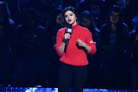 Selena Gomezs Red Sweater On We Day 2018 Popsugar Fashion Uk Photo 3
