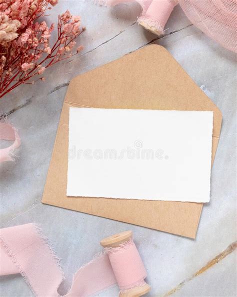 Card With Envelope On Table With Pink Flowers And Ribbons Stock Photo Image Of Greeting Empty