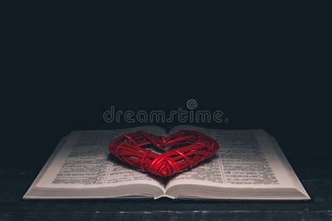 Open Bible Red Heart On The Book Holy Bible On A Black Background