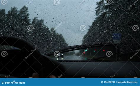 Rain Drop On The Car Glass Backgroundroad View Through Car Window With