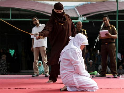 indonesian woman lashed 100 times for ‘being in presence of man she was not married to