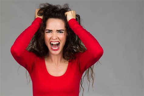 Very frustrated angry woman screaming - The Stone Foundation