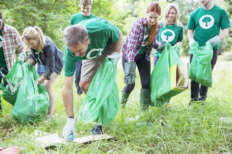 Environmentalist Volunteers Picking Up Trash Stock Photo