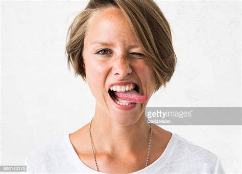 Woman Sticking Out Tongue Photos And Premium High Res Pictures Getty