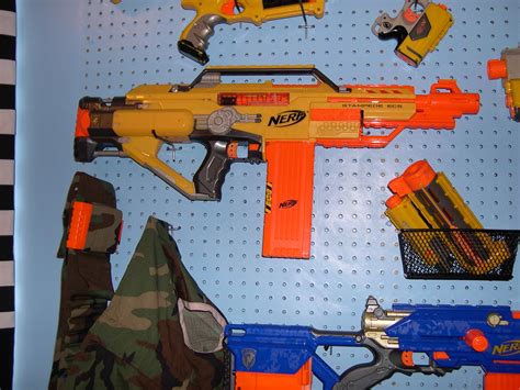 Maybe you would like to learn more about one of these? Nerf gun rack close-up | Bonus bandolier and Army vest ...